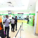 Customers qeue in the bank