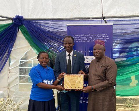 U.S. CDC Country Director Dr. Mary Adetinuke Boyd presents Lifetime Achievement Award to...