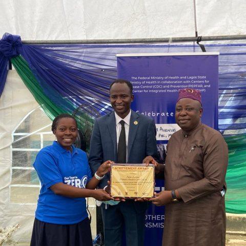 U.S. CDC Country Director Dr. Mary Adetinuke Boyd presents Lifetime Achievement Award to...