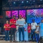 Valentine Ozigbo, offering cash award to winners of he 2021 Unusual Entrepreneurs during the Unusual Praise Event at the Basilica of the Most Holy Trinity, Onitsha
