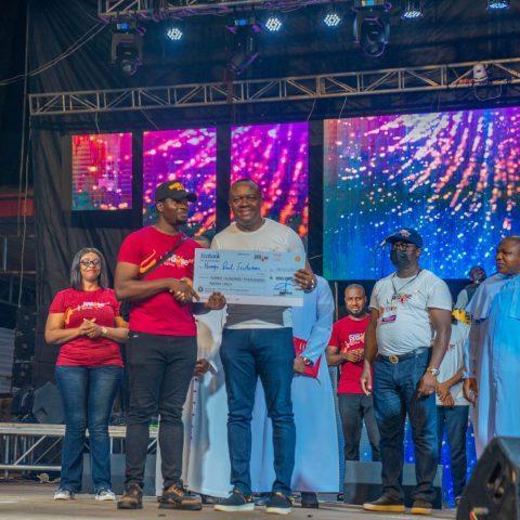 Valentine Ozigbo, offering cash award to winners of he 2021 Unusual Entrepreneurs during the Unusual Praise Event at the Basilica of the Most Holy Trinity, Onitsha