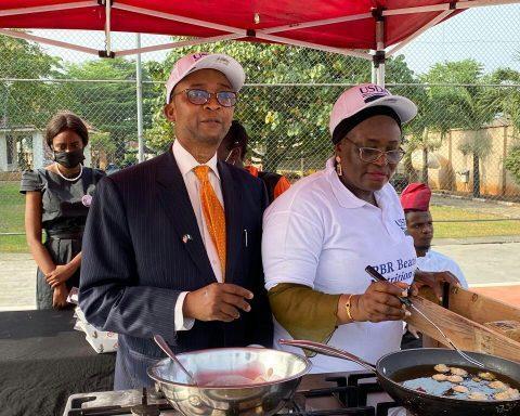 US Mission Counselor for Agricultural Affairs Gerald Smith with a chef making bean cake from Bt Cowpea at the event on Thursday