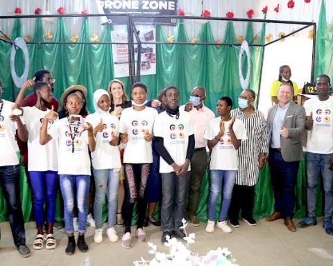 The winning Pace Setters Team from Ijaiye Housing Estate Senior Grammar School in a group photograph with U.S. Consulate Public Affairs Officer Stephen Ibelli (third right) and U.S. Consulate Deputy Public Affairs Officer Jenny Foltz (second row, third left) with Lagos State Commissioner for Education Folasade Adefisayo during the closing ceremony of the drone soccer competition in Lagos on Saturday.