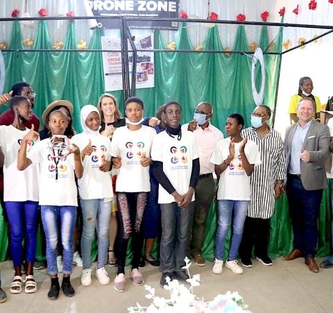 The winning Pace Setters Team from Ijaiye Housing Estate Senior Grammar School in a group photograph with U.S. Consulate Public Affairs Officer Stephen Ibelli (third right) and U.S. Consulate Deputy Public Affairs Officer Jenny Foltz (second row, third left) with Lagos State Commissioner for Education Folasade Adefisayo during the closing ceremony of the drone soccer competition in Lagos on Saturday.