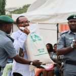 PHOTOS: Fight As Nigerians Scramble For Customs Rice In Yaba