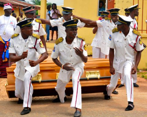 Undertakers dancing with casket on their way to the burial site Abiriba Abia State nigeria