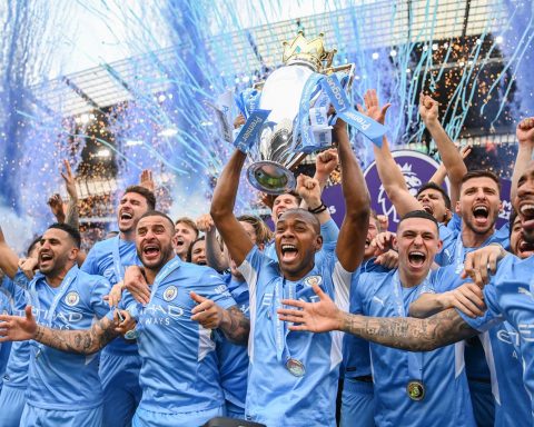 Manchester City Football Club team celebrates with Premier League trophy championship May ()