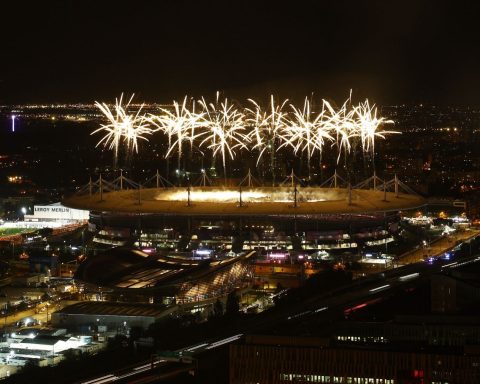 Fireworks explode above the Stade de France
