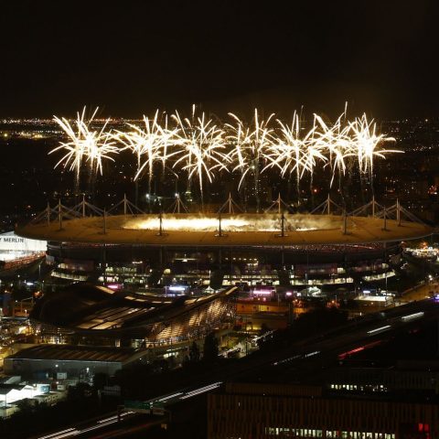 Fireworks explode above the Stade de France