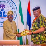 Tinubu with National Defence College official