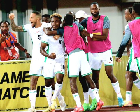 Teammates mob Dele Bashiru after his saved the day with a lone goal