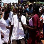 Tambura residents walk and dance their way to Peace Day celebrations