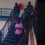 Dele Farotimi in handcuffs (pink shirt) at court today