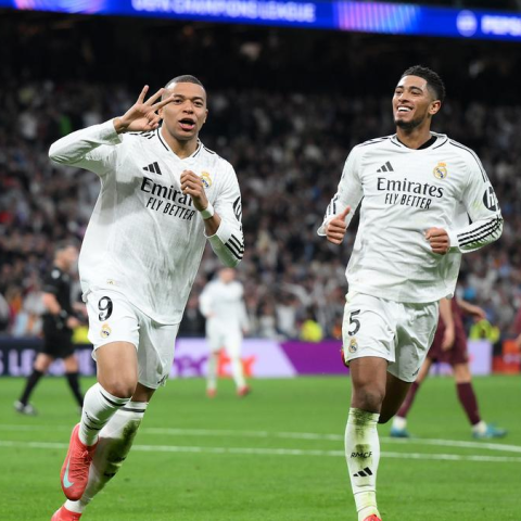 Real Madrid forward and hat trick hero Kylian Mbappe celebrates Bellingham