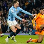 Real Madrid's Jude Bellingham delivers to sack Manchester City