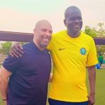 Super EAgles Coach Eric Chelle and Flying Eagles handler Aliyu Zubairu