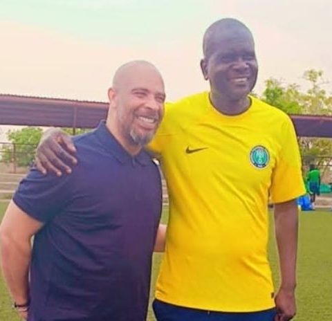 Super EAgles Coach Eric Chelle and Flying Eagles handler Aliyu Zubairu