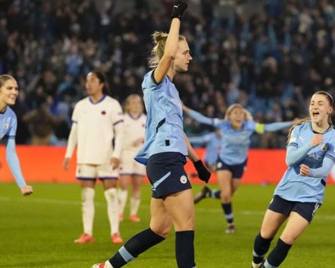 Miedema celebrates her opener before making it a brace