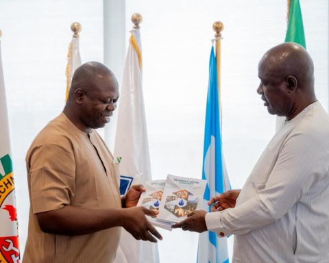 Ezeobi presents copies of his book to Minister Lokpobiri