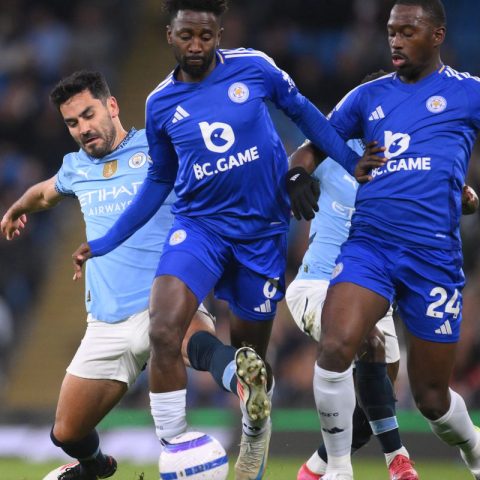 Leicester City's Wilfred Nddi attempt to stop Jack Grealish