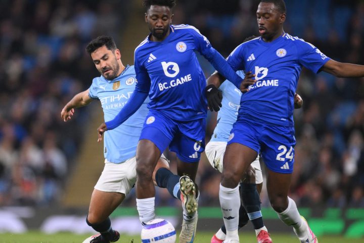 Leicester City's Wilfred Nddi attempt to stop Jack Grealish