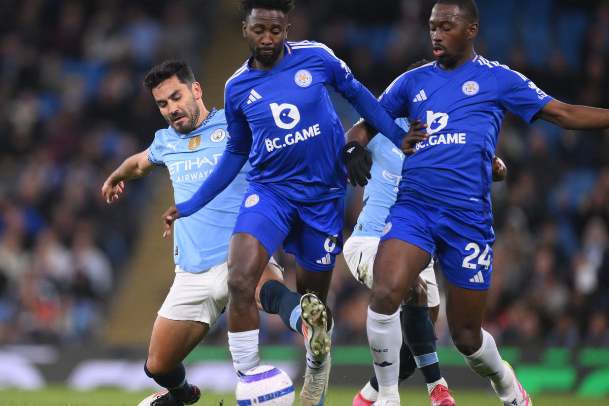 Leicester City's Wilfred Nddi attempt to stop Jack Grealish