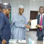 Minister of Housing and EFCC chairman during handopver of recovered assets in Abuja