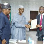 Minister of Housing and EFCC chairman during handopver of recovered assets in Abuja