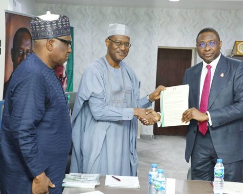Minister of Housing and EFCC chairman during handopver of recovered assets in Abuja