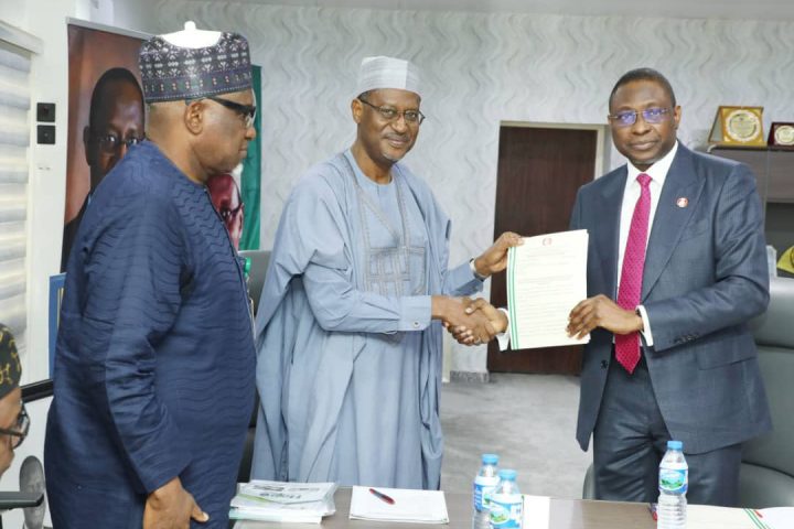 Minister of Housing and EFCC chairman during handopver of recovered assets in Abuja