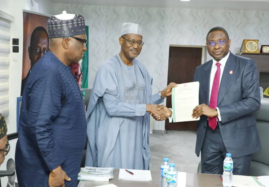 Minister of Housing and EFCC chairman during handopver of recovered assets in Abuja