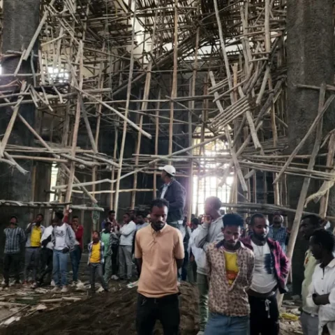 Worshippers stand inside the Menjar Shenkora Arerti Mariam Church under construction that collapsed in Arerti, Amhara region of northern Ethiopia, on Wednesday, October 1, 2025 [Samuel Getachew/AP Photo]