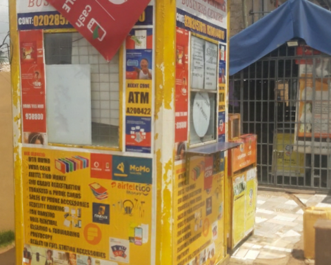 Image of Ghana Mobile Money Kiosk and Ghana Flag