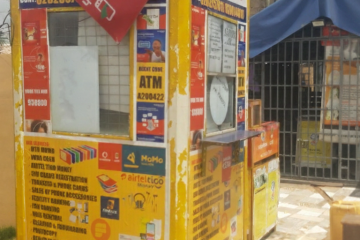 Image of Ghana Mobile Money Kiosk and Ghana Flag