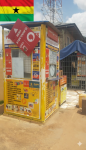 Image of Ghana Mobile Money Kiosk and Ghana Flag